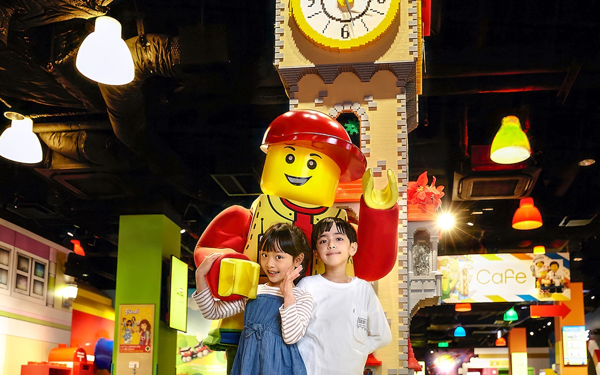 Family with LEGO figure at LEGOLAND Discovery Center, Osaka.