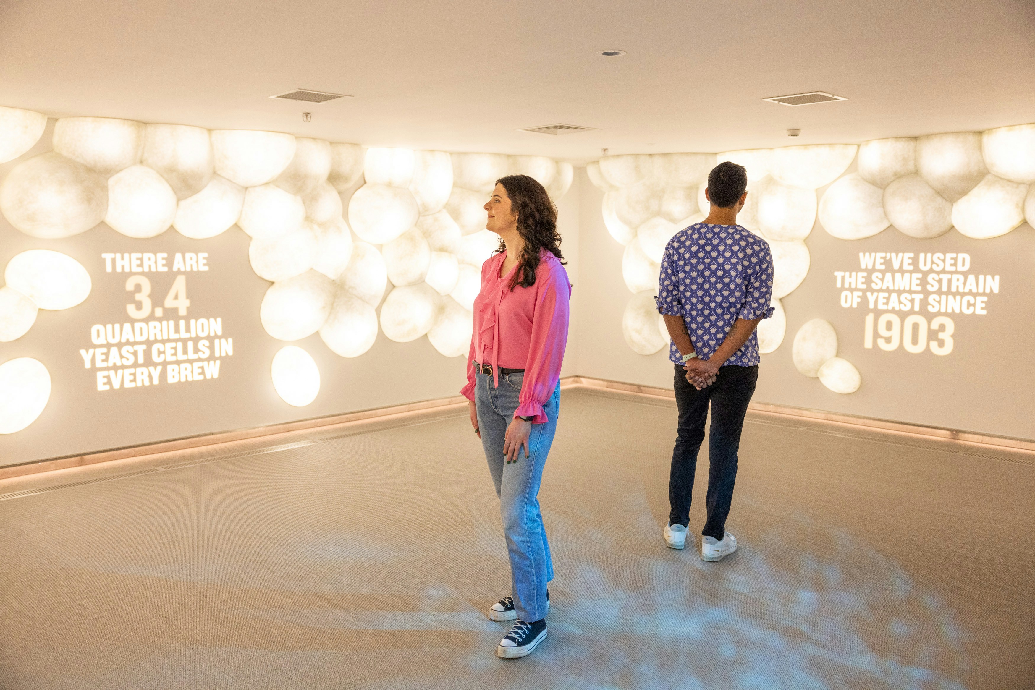 Visitors exploring yeast exhibit at Guinness Storehouse, Dublin.
