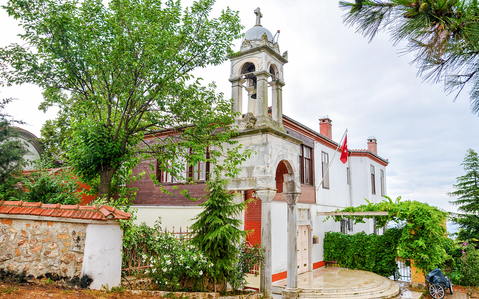 Aya Yorgi Monastery exterior with bell tower and Turkish flag, Buyukada.