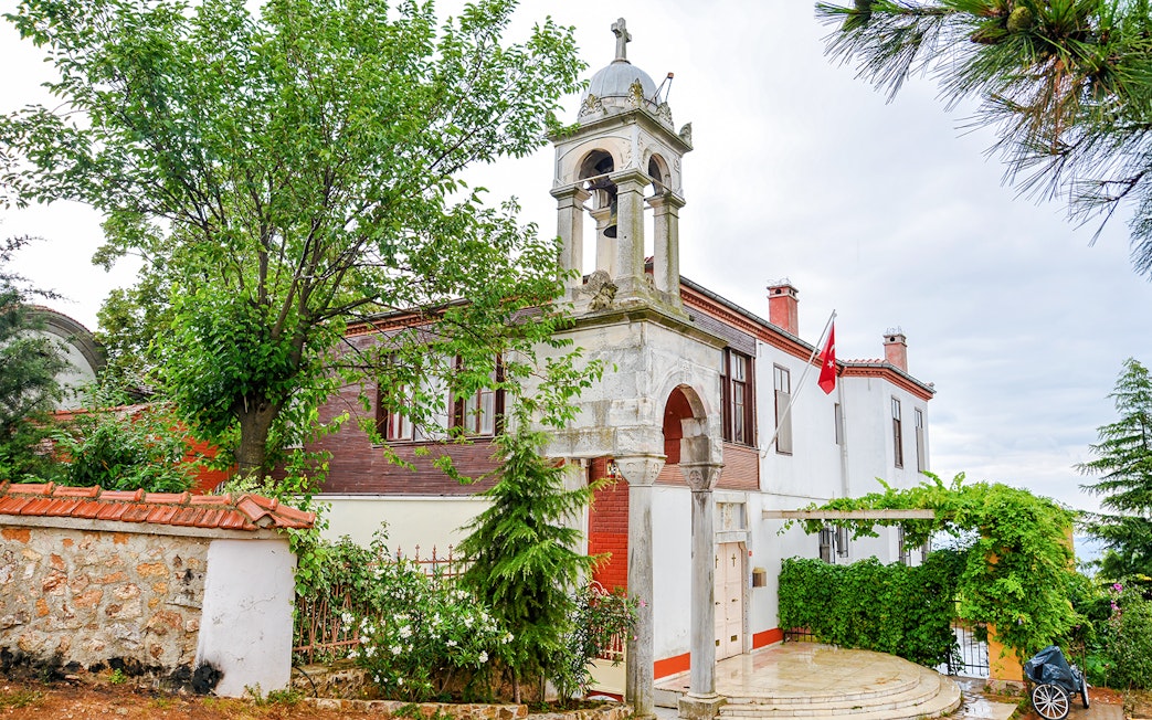 Aya Yorgi Monastery exterior with bell tower and Turkish flag, Buyukada.