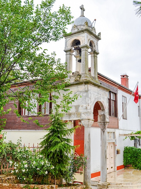 Aya Yorgi Monastery exterior with bell tower and Turkish flag, Buyukada.