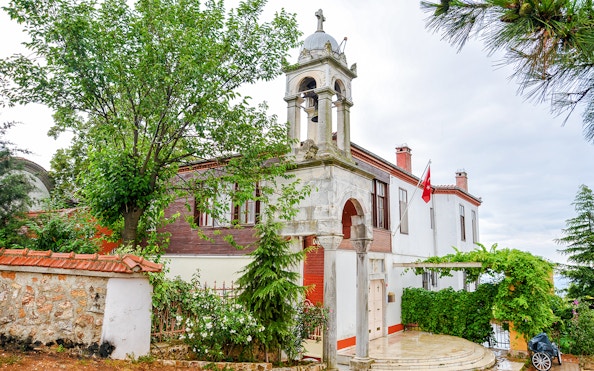 Aya Yorgi Monastery exterior with bell tower and Turkish flag, Buyukada.