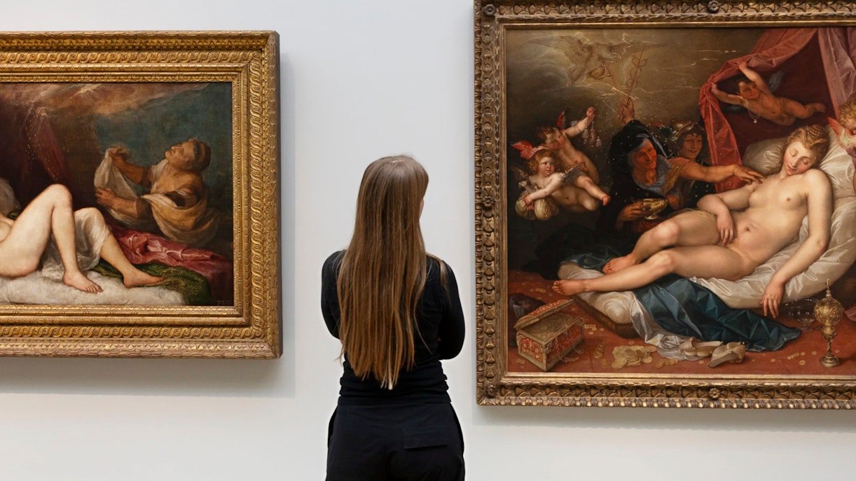 Visitor admiring Ovid-inspired paintings at the Rijksmuseum, Amsterdam.