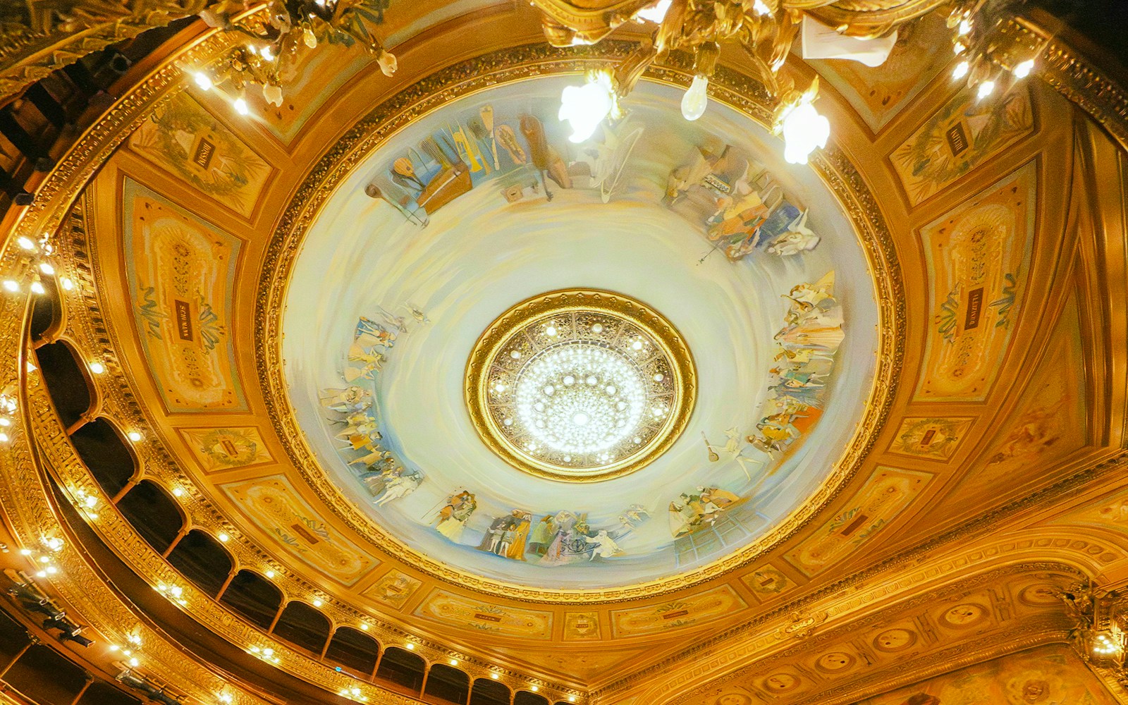 Ceiling fresco and chandelier in the grand foyer of Teatro Colon, Buenos Aires, Argentina.