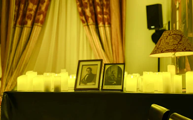 Chopin portraits surrounded by candles at Chopin Gallery, Krakow.