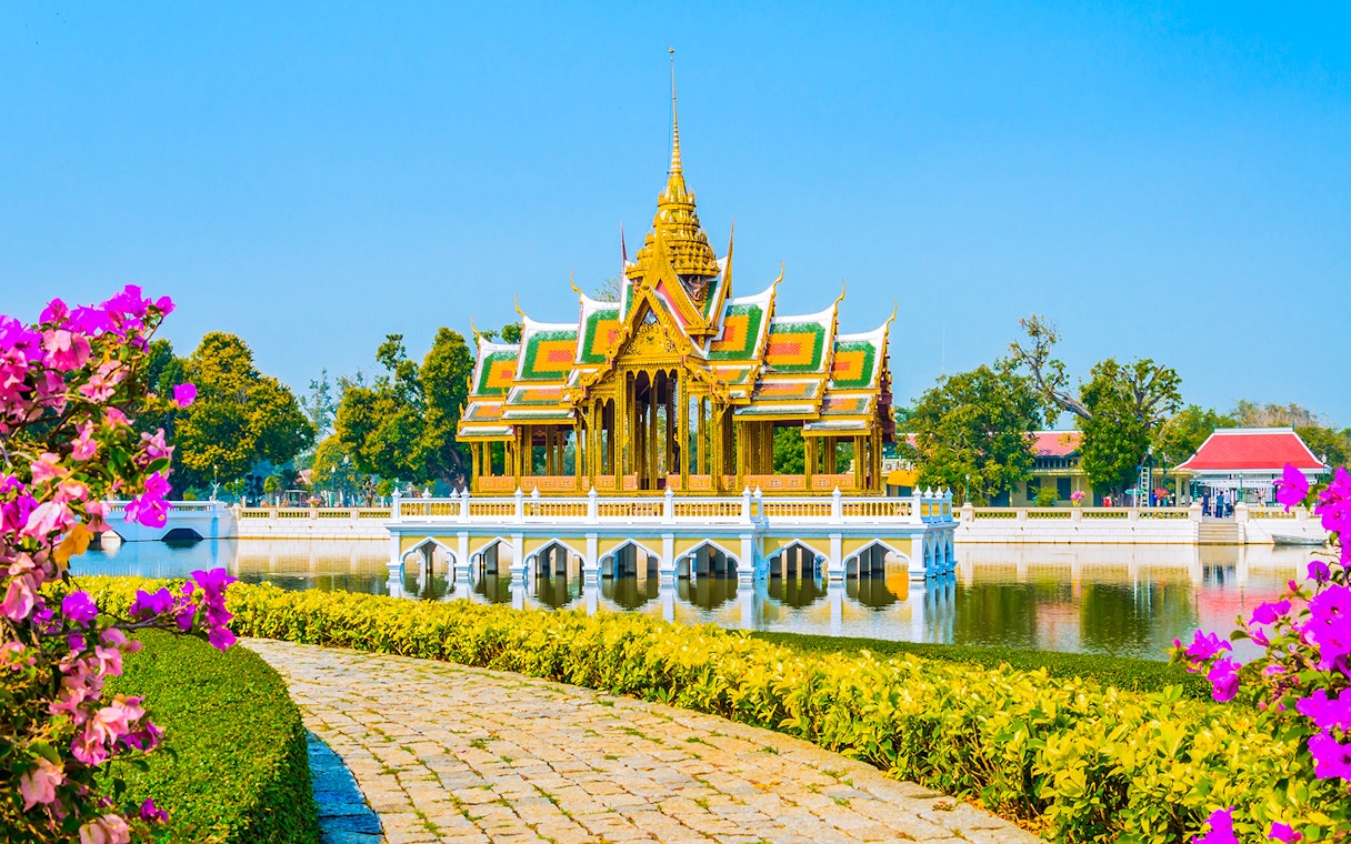 Bang Pa-In Royal Palace pavilion on a lake in Ayutthaya, surrounded by gardens.