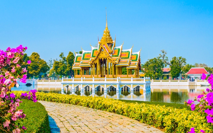Bang Pa-In Royal Palace pavilion on a lake in Ayutthaya, surrounded by gardens.