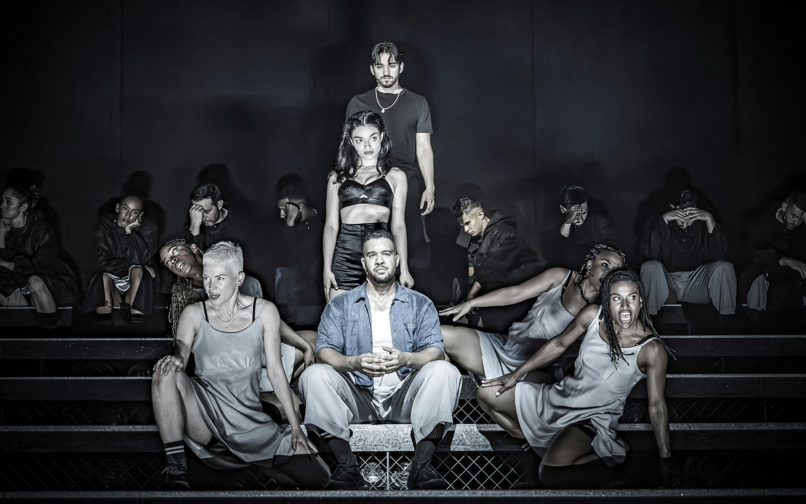 Performers on stage during Evita musical production.