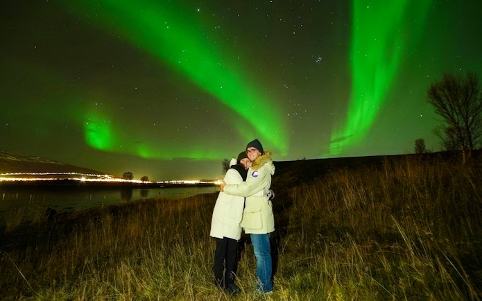 Tourists viewing Northern Lights on Small Group Northern Lights Chase Tour.