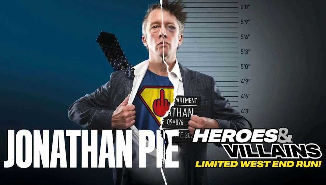 Jonathan Pie in split superhero and mugshot attire for Heroes and Villains show.