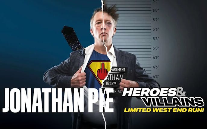 Jonathan Pie in split superhero and mugshot attire for Heroes and Villains show.