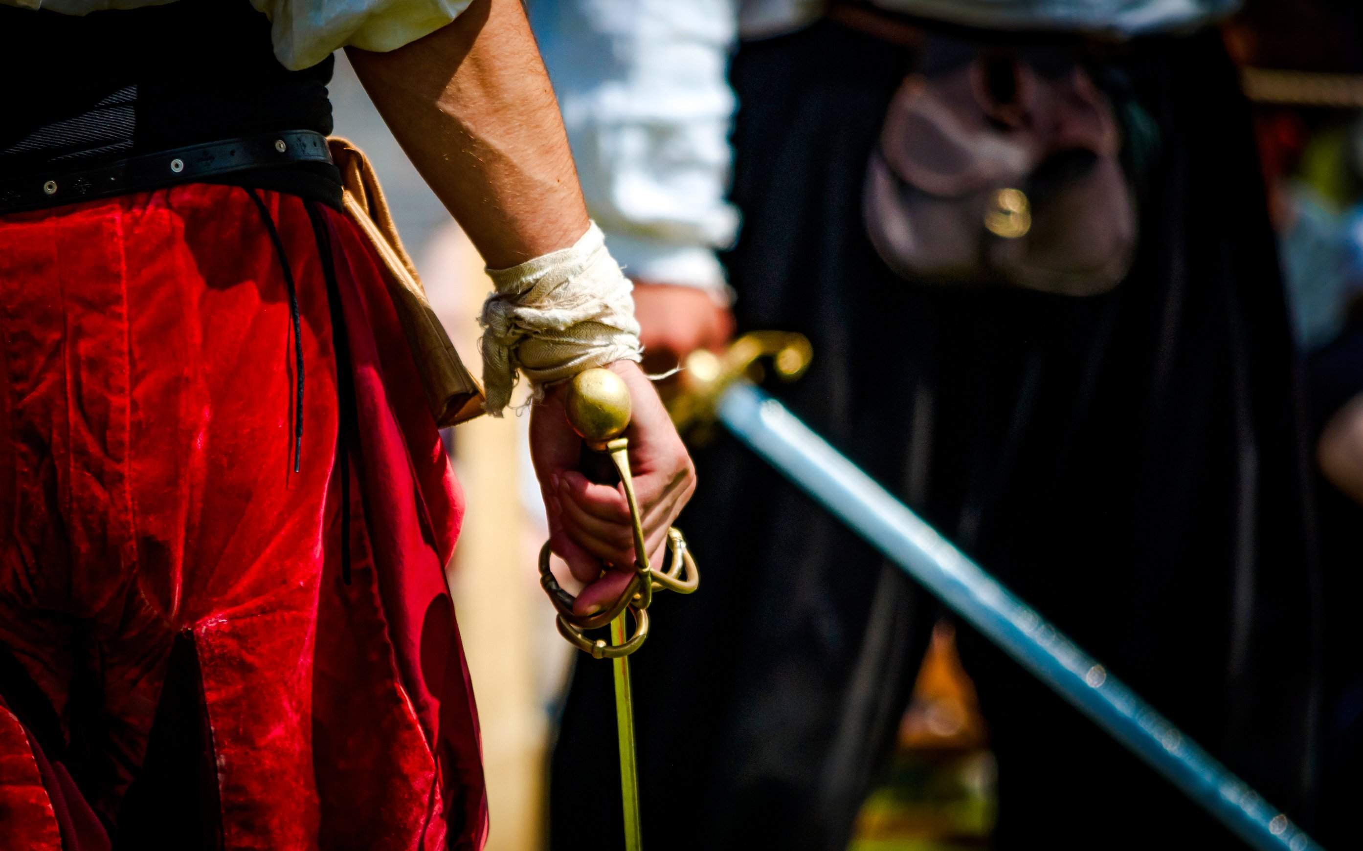 Pirate holding a sword during a reenactment event.