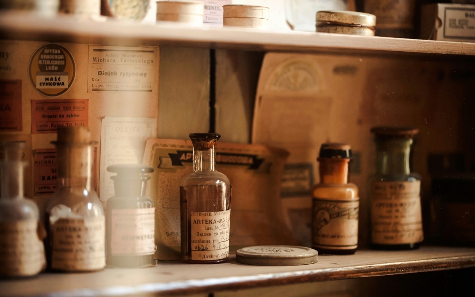 Vintage medicine bottles on display at New Orleans Pharmacy during Haunted Ghost, Voodoo & Vampire Tour.