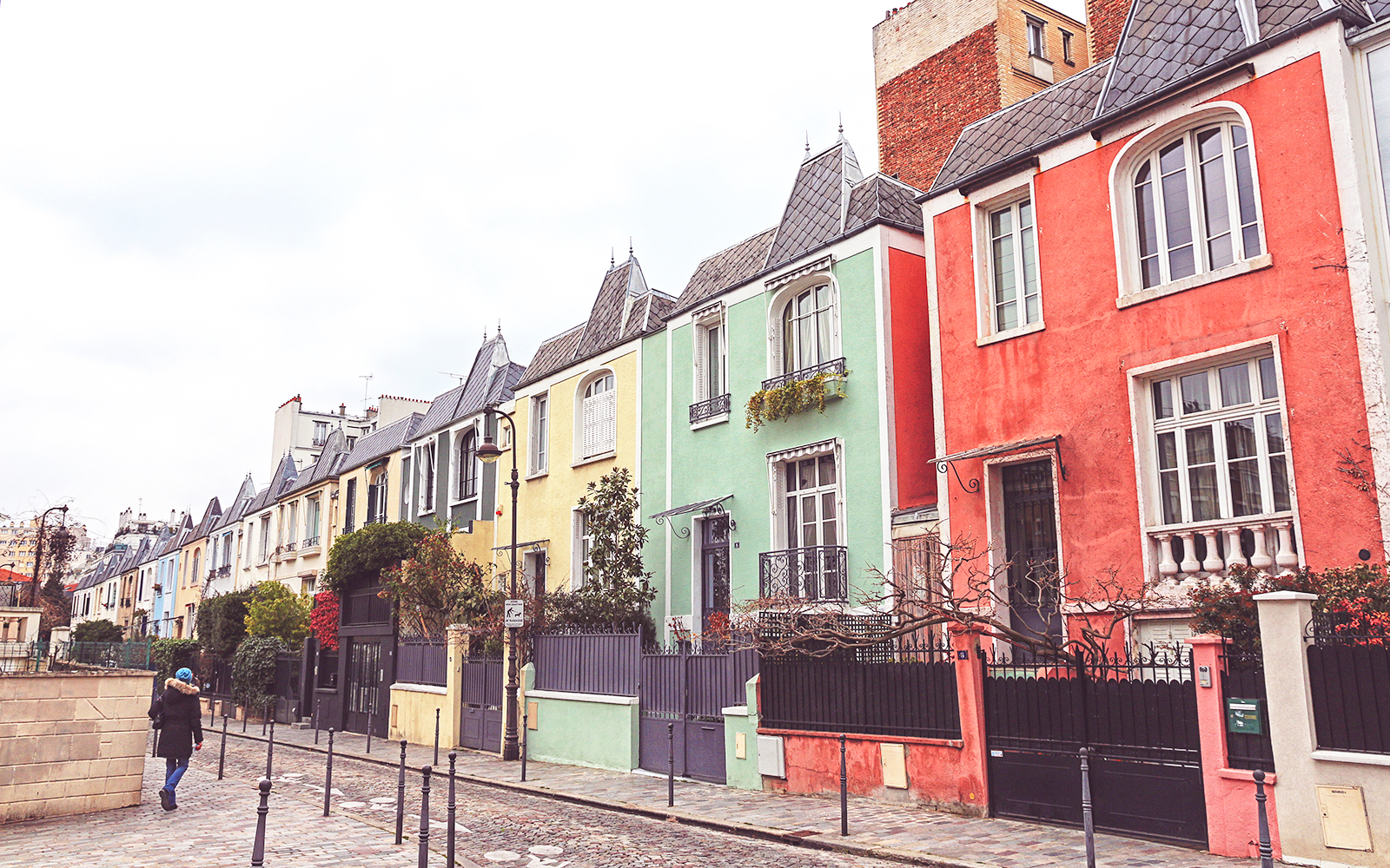 Colorful row of houses on a street in Butte-aux-Cailles, Paris.