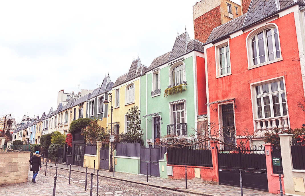 Colorful row of houses on a street in Butte-aux-Cailles, Paris.