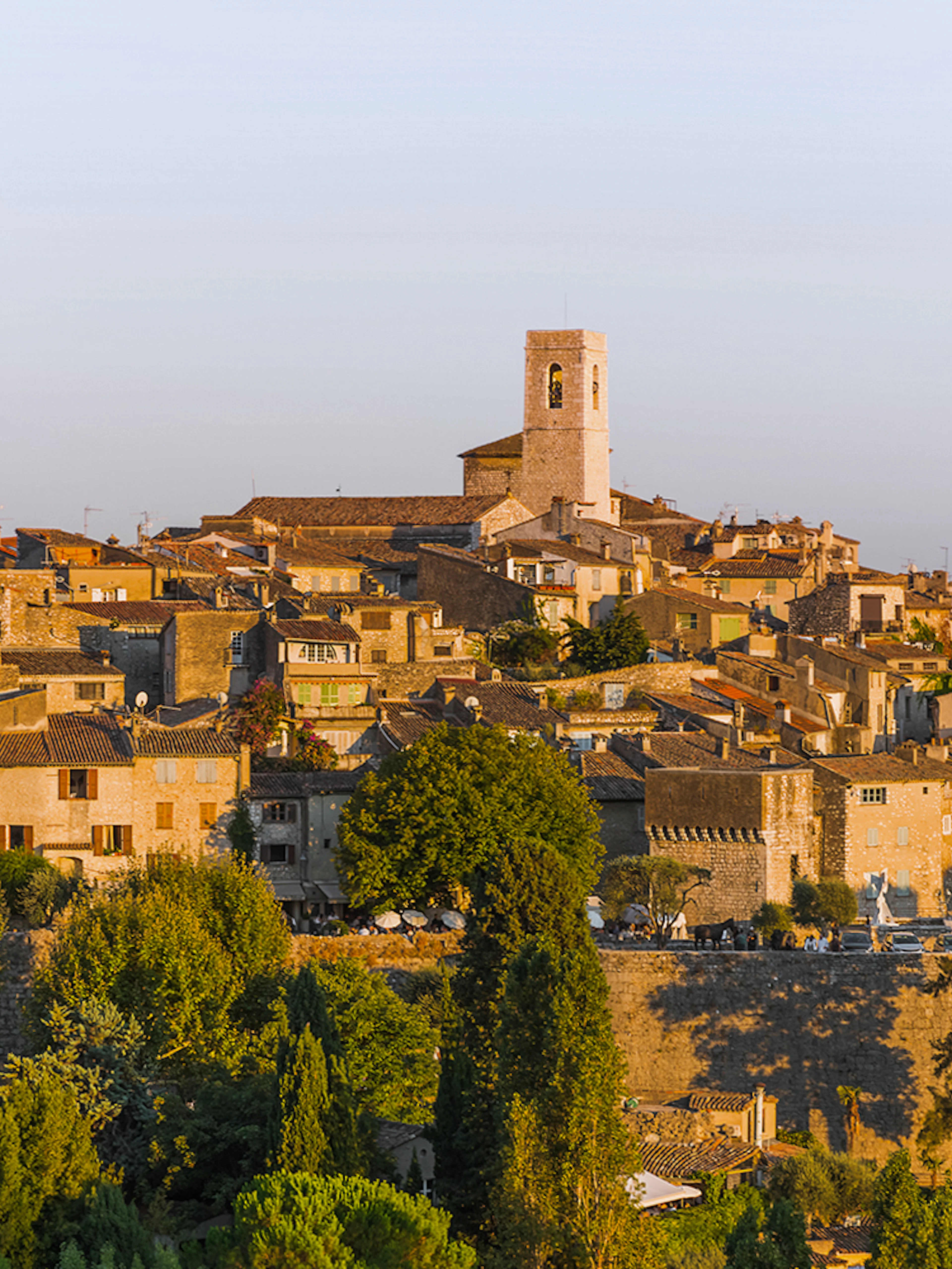 Saint Paul de Vence village with stone buildings and church tower in Provence, France.