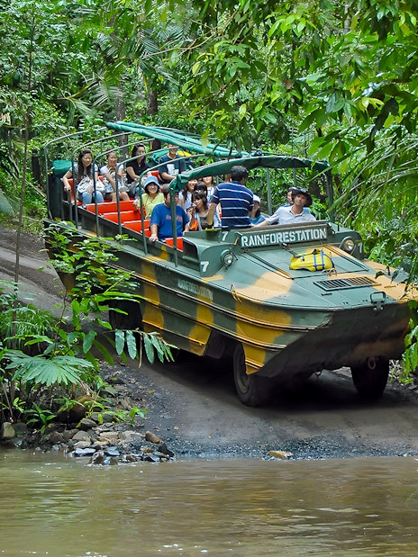 Tourists on an Army Duck vehicle exploring Kuranda rainforest, Queensland.