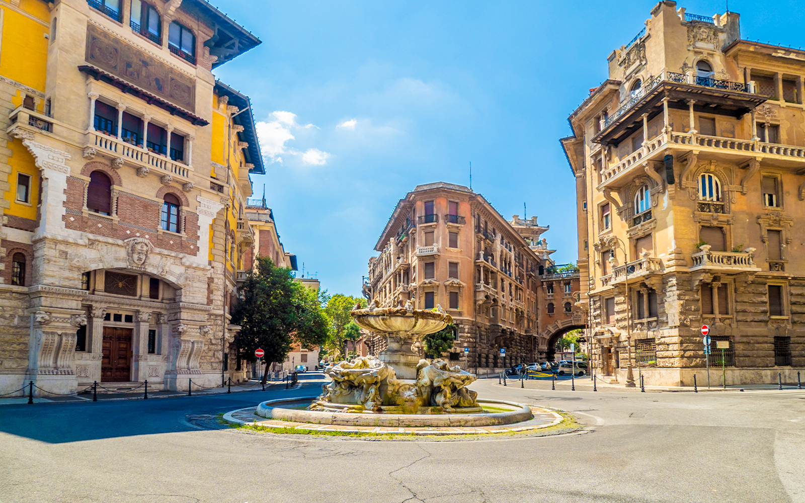 Frog fountain in Quartiere Coppedè, Rome, designed by Gino Coppedè, surrounded by symbolic architecture.