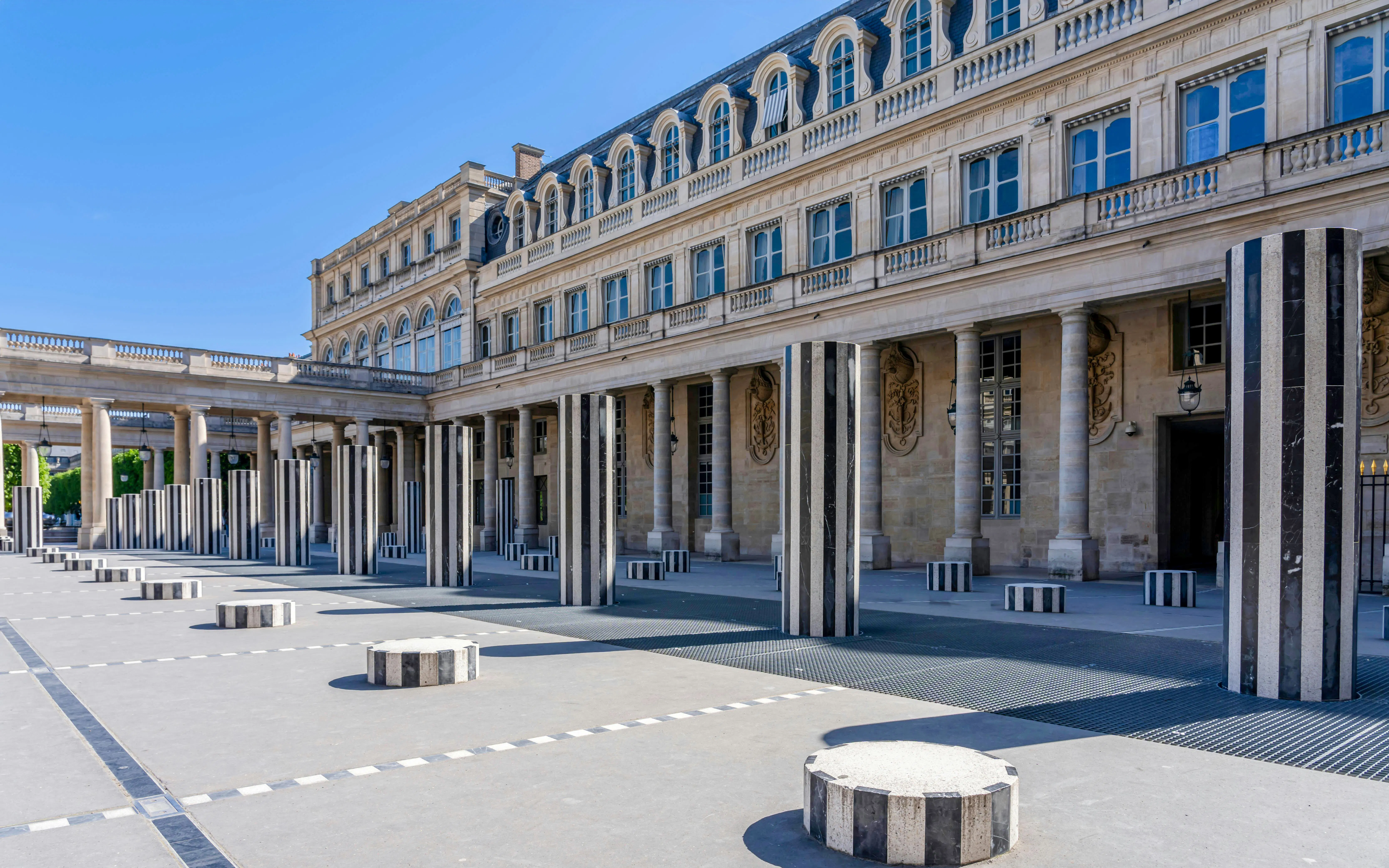 Colonnes de Buren installation at Palais Royal, Paris, featuring striped columns.