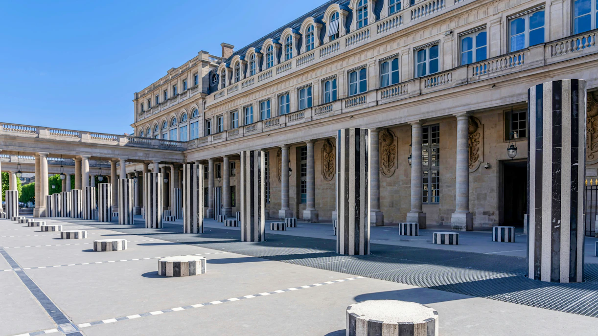 Colonnes de Buren installation at Palais Royal, Paris, featuring striped columns.