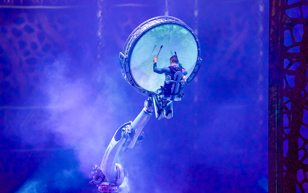 Performer in mechanical arm at La Perle by Dragone show in Dubai.