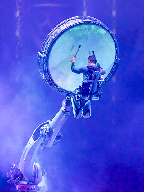 Performer in mechanical arm at La Perle by Dragone show in Dubai.
