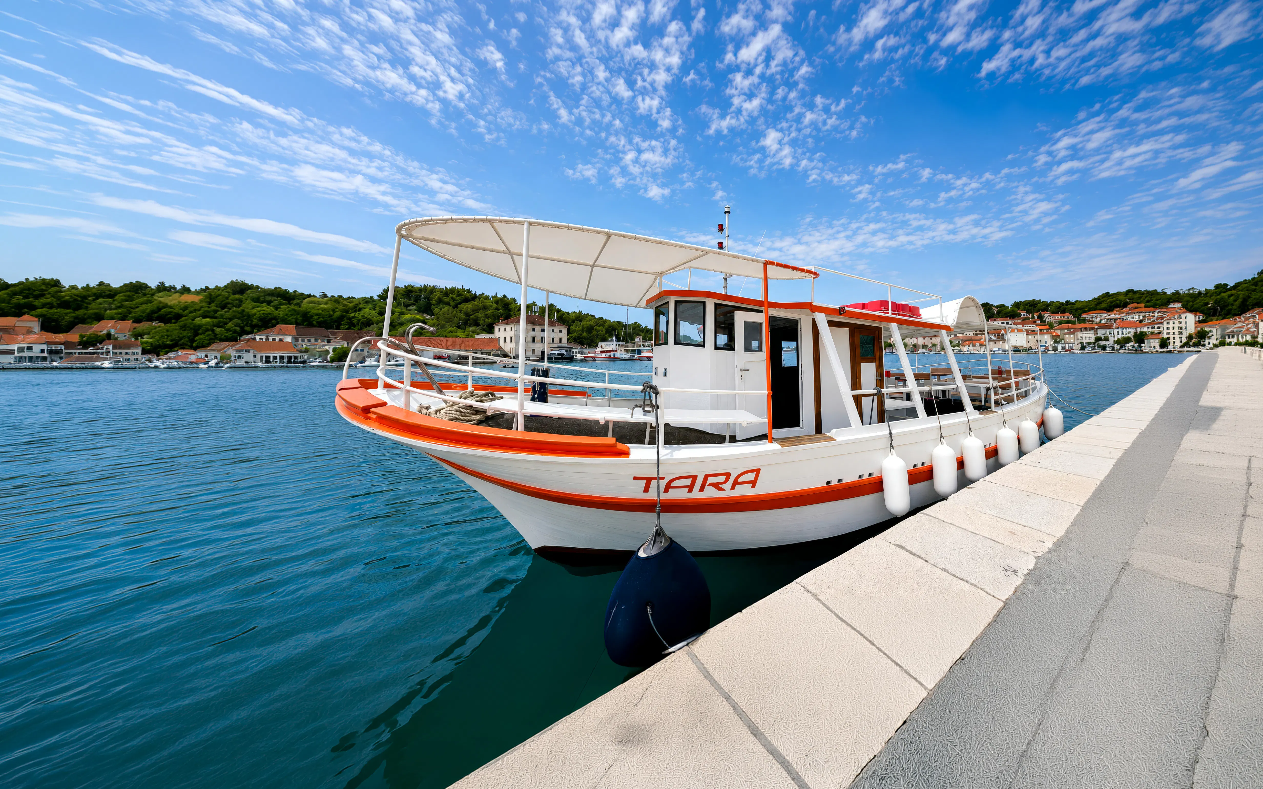 Boat docked in Trogir for Blue Lagoon and Maslinica tour.