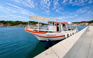 Boat docked in Trogir for Blue Lagoon and Maslinica tour.