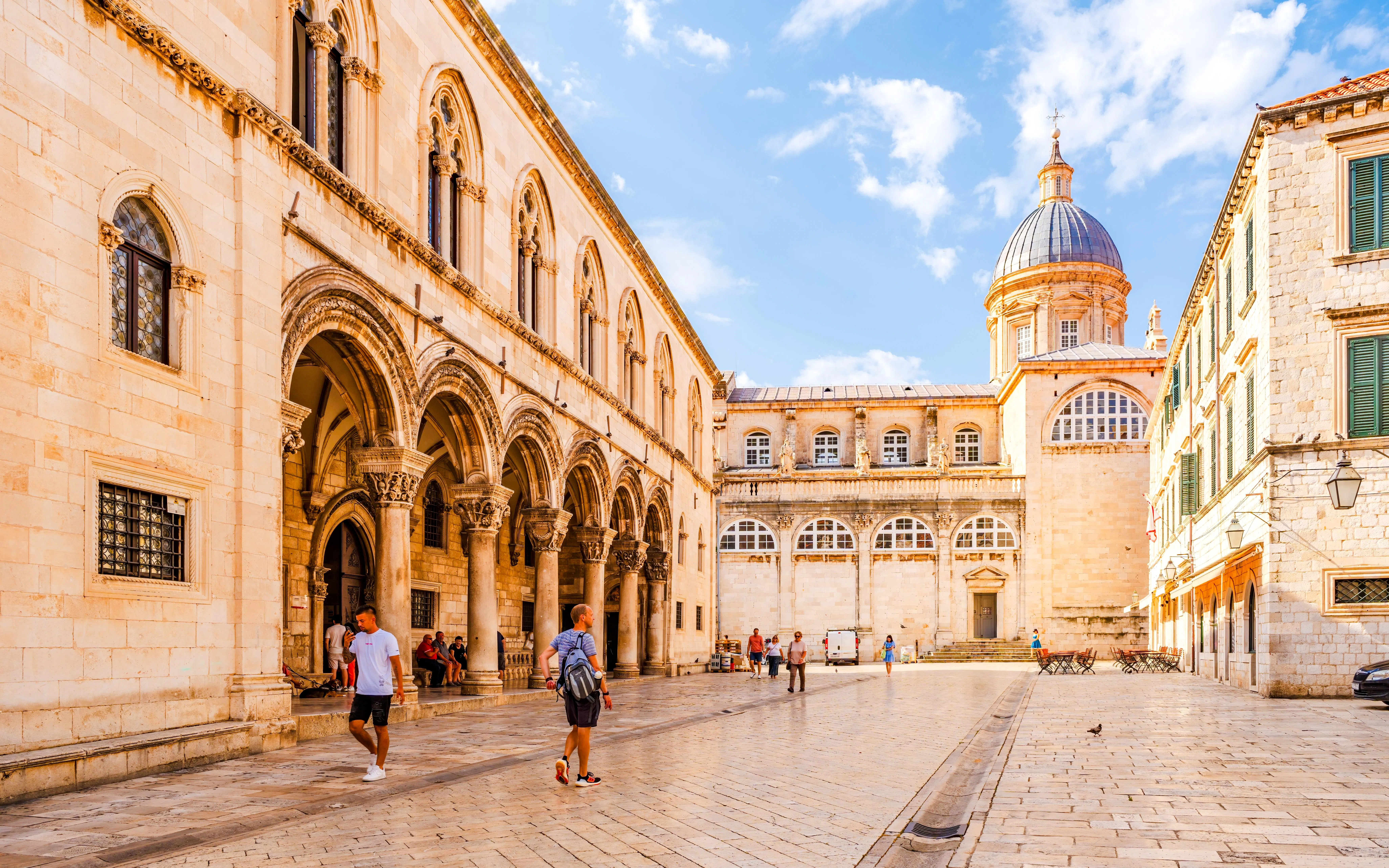 Rector's Palace on the left with Dubrovnik Cathedral dome in the background, Croatia.