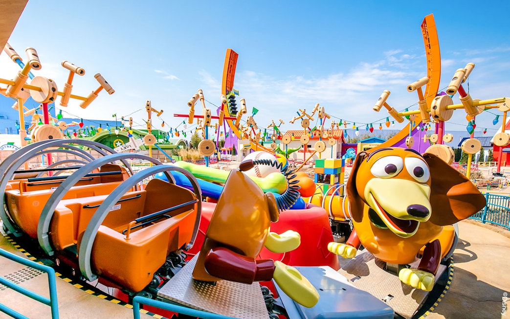 Slinky Dog ride at Shanghai Disney's Toy Story Land with colorful decorations.