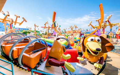 Slinky Dog ride at Shanghai Disney's Toy Story Land with colorful decorations.