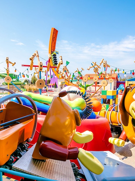 Slinky Dog ride at Shanghai Disney's Toy Story Land with colorful decorations.