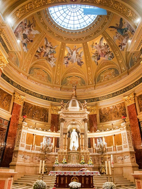 Interior view of St. Stephen's Basilica in Budapest, showcasing ornate dome and altar.