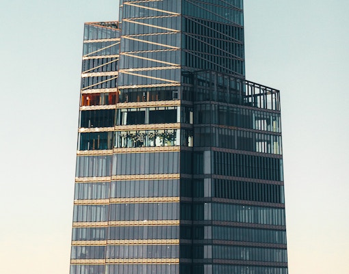 SUMMIT One Vanderbilt observation deck at sunset, New York City skyline view.