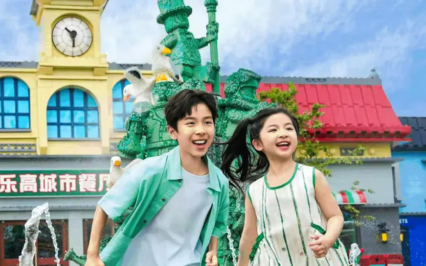 Children running near LEGO sculptures at LEGOLAND® Shanghai Resort.
