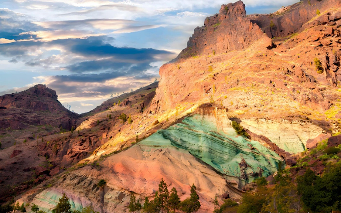 Los Azulejos de Veneguera rock formations with colorful layers in Mogán, Gran Canaria, Spain.