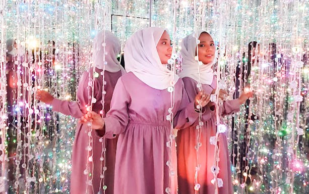 Visitors exploring light installation at Wonderpark Melaka.