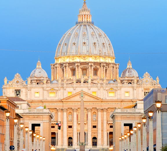 St. Peter's Basilica dome in Vatican City at sunset.