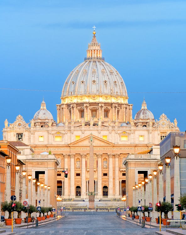 St. Peter's Basilica dome in Vatican City at sunset.