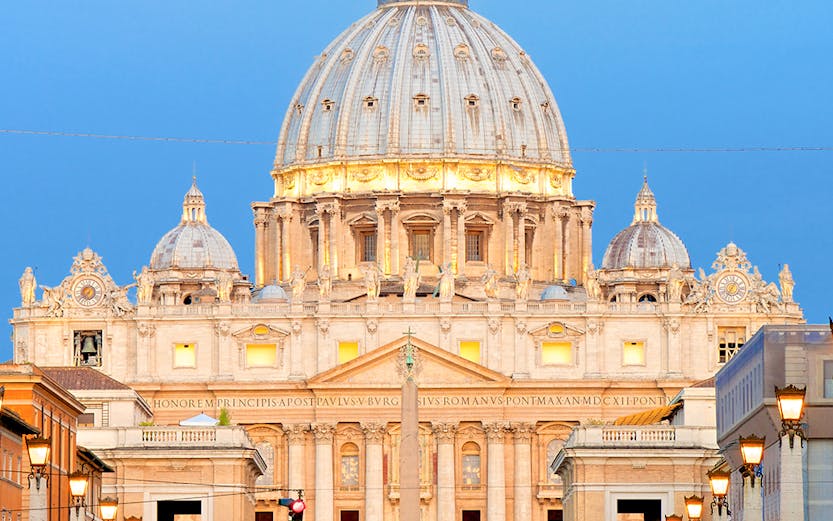 St. Peter's Basilica dome in Vatican City at sunset.