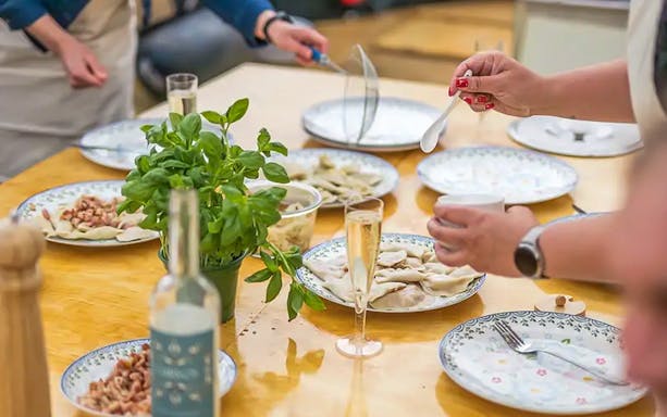 Guests sampling pierogi on Motława River Cruise in Gdansk.