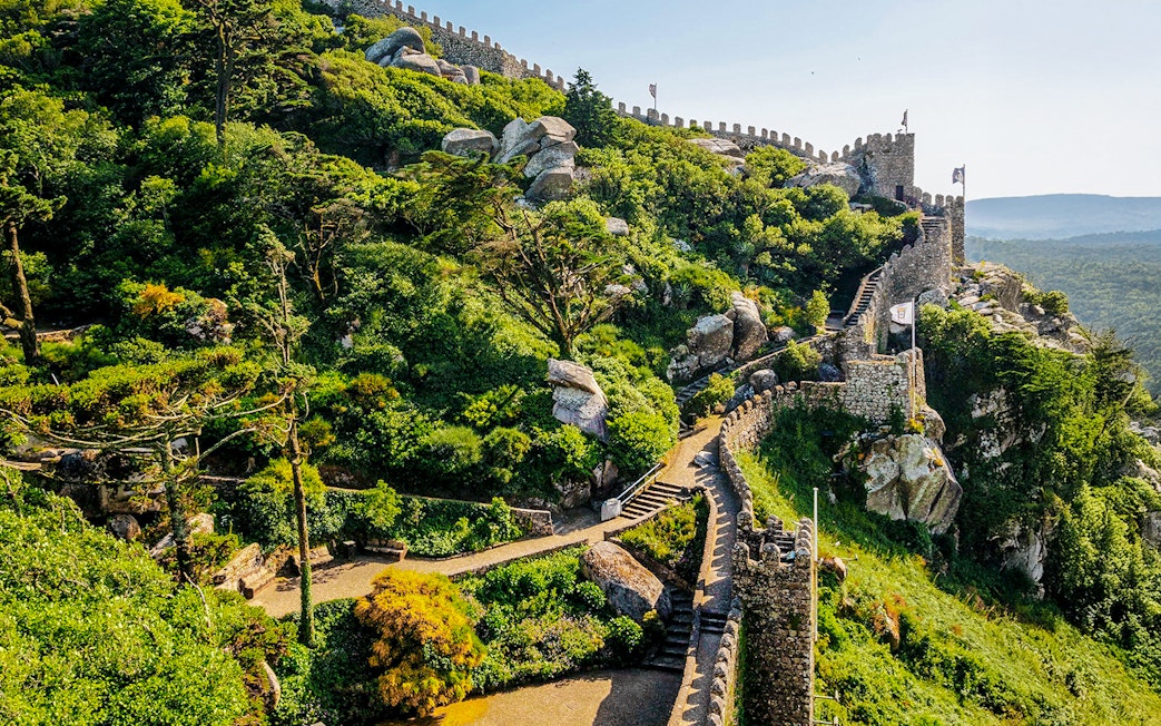 Ancient stone walls of Moorish Castle with scenic views in Sintra, Portugal.