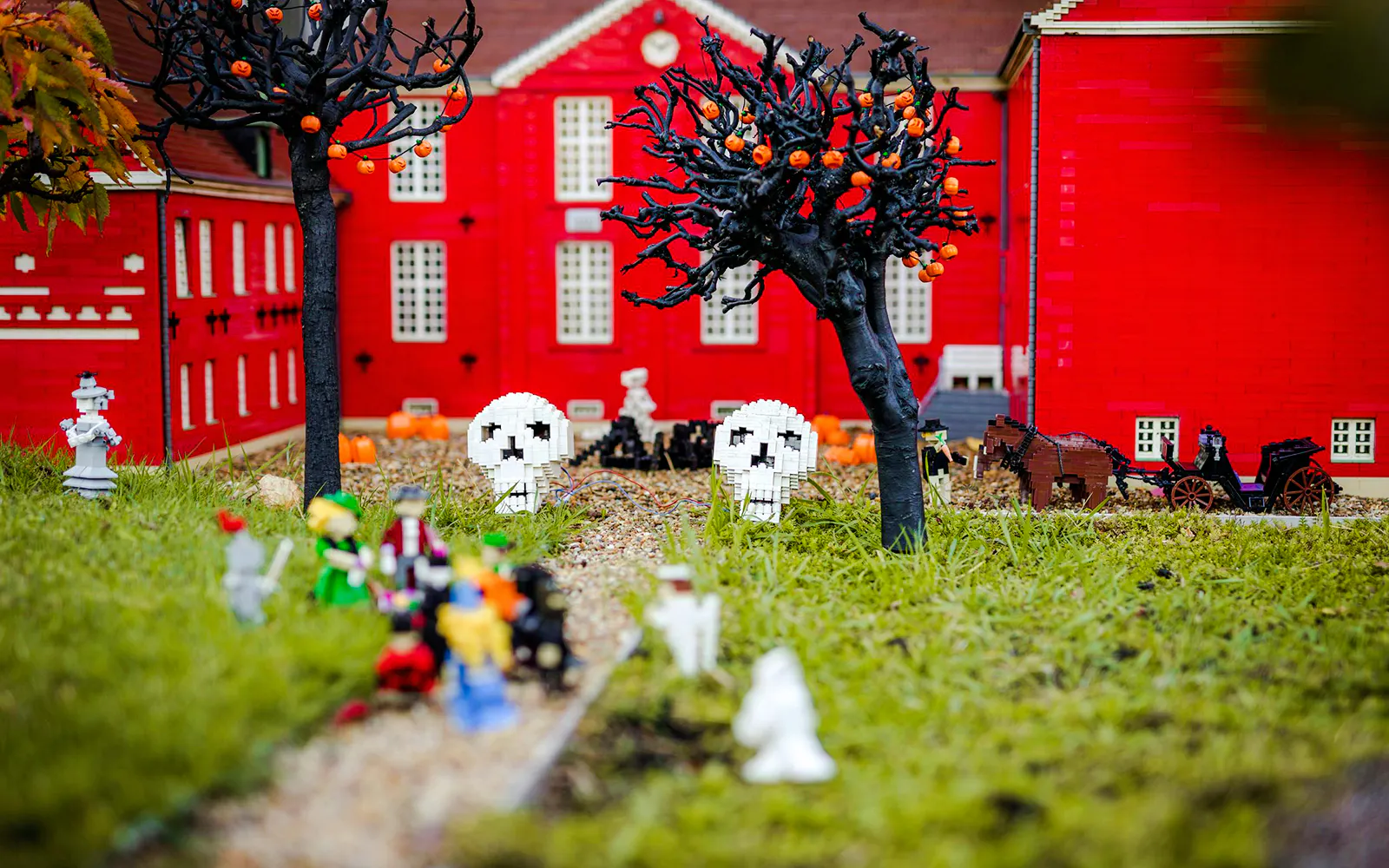 Halloween-themed Lego display with skulls and pumpkins at Legoland Billund.