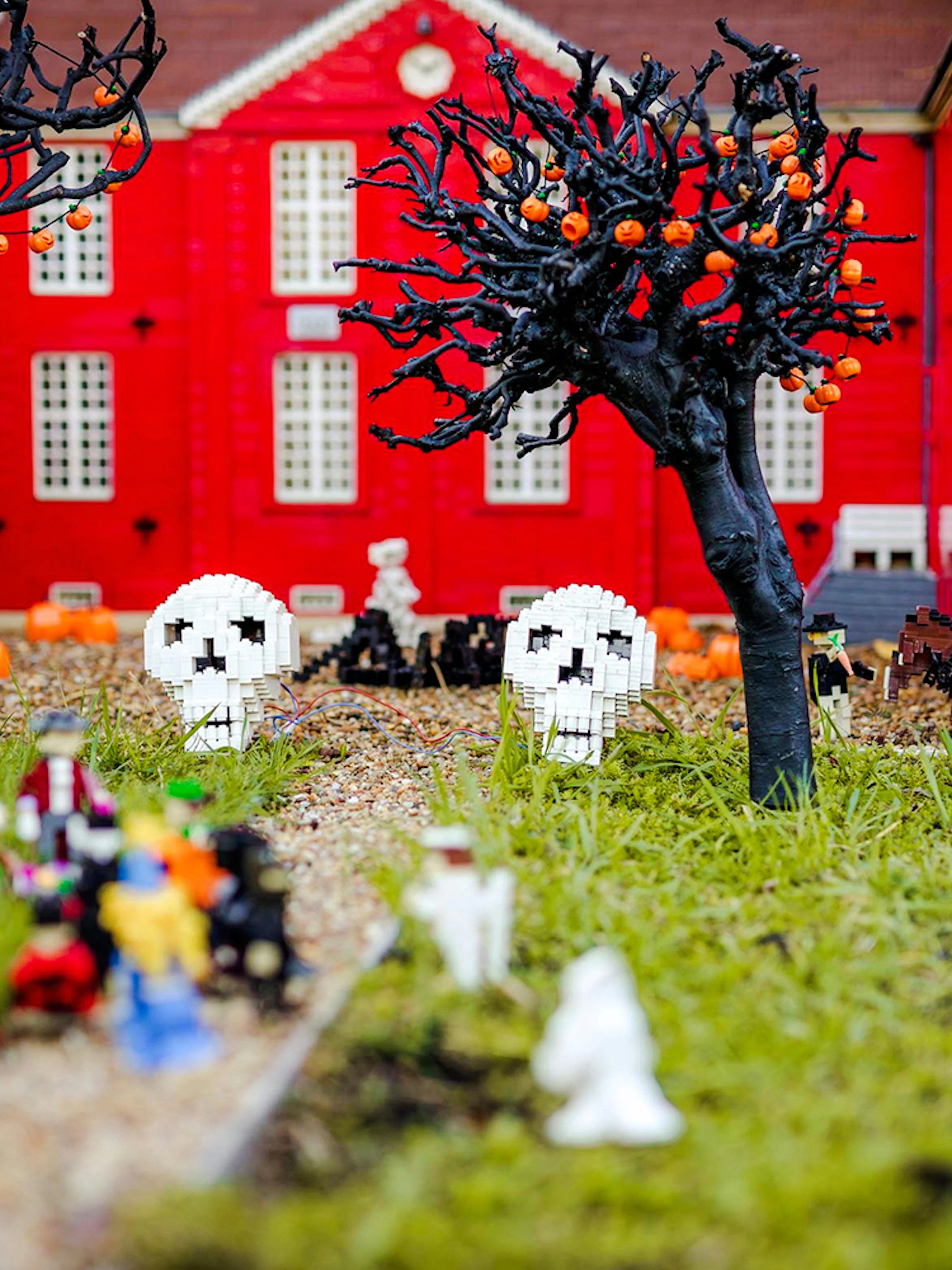 Halloween-themed Lego display with skulls and pumpkins at Legoland Billund.