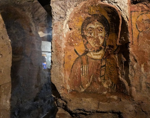Capuchin Crypt frescoes depicting religious scenes in Rome, Italy.