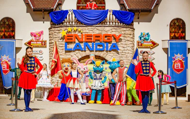 Welcome parade with performers and mascots at Energylandia Theme Park, Zator, near Krakow, Poland.