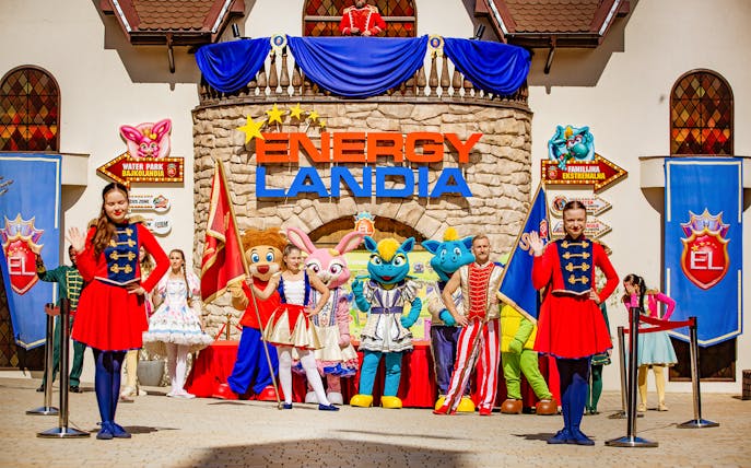 Welcome parade with performers and mascots at Energylandia Theme Park, Zator, near Krakow, Poland.