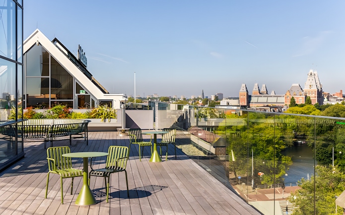 Rooftop view from Heineken Experience in Amsterdam with cityscape and canal.