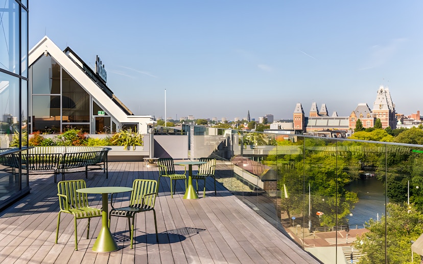 Rooftop view from Heineken Experience in Amsterdam with cityscape and canal.