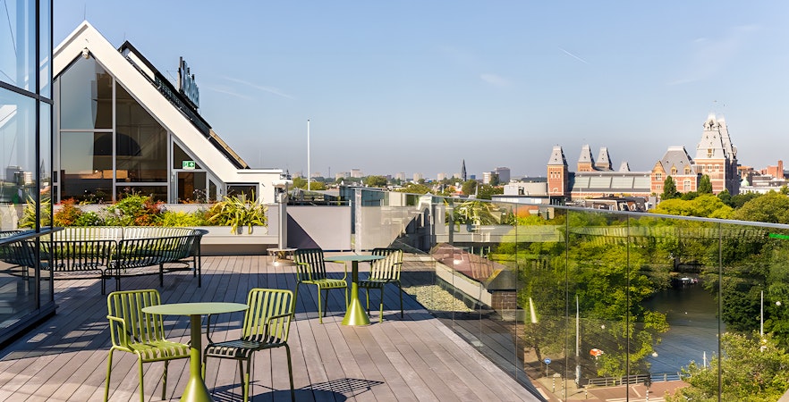 Rooftop view from Heineken Experience in Amsterdam with cityscape and canal.